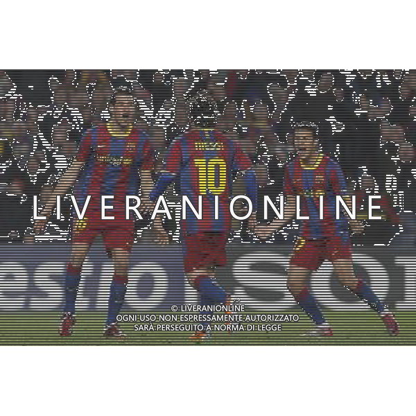 FC Barcelona\'s Leo Messi (c), Sergio Busquets (l) and Pedro Rodriguez celebrate goal during UEFA Champions League match.March 8,2011. Photo: Acero / Alterphotos / ALFAQUI /AG ALDO LIVERANI SAS CHAMPIONS LEAGUE BARCELLONA ARSENAL - ITALY ONLY -