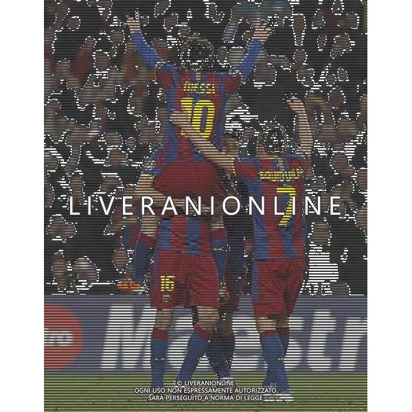 FC Barcelona\'s Leo Messi (t), Sergio Busquets (l), Pedro Rodriguez and David Villa celebrate goal during UEFA Champions League match.March 8,2011. Photo: Acero / Alterphotos / ALFAQUI /AG ALDO LIVERANI SAS CHAMPIONS LEAGUE BARCELLONA ARSENAL - ITALY ONLY -