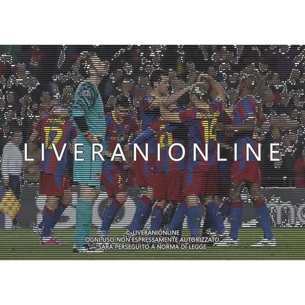 FC Barcelona\'s players celebrate goal in presence of Arsenal\'s Manuel Almunia dejected during UEFA Champions League match.March 8,2011. Photo: Acero / Alterphotos / ALFAQUI /AG ALDO LIVERANI SAS CHAMPIONS LEAGUE BARCELLONA ARSENAL - ITALY ONLY -