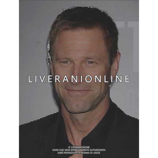 Aaron Eckhart Photo by Gilbert Flores \'Battle: Los Angeles \' Los Angeles Premiere at the Regency Village Theatre March 8, 2011 - Westwood, California /AG ALDO LIVERANI SAS - ITALY ONLY -