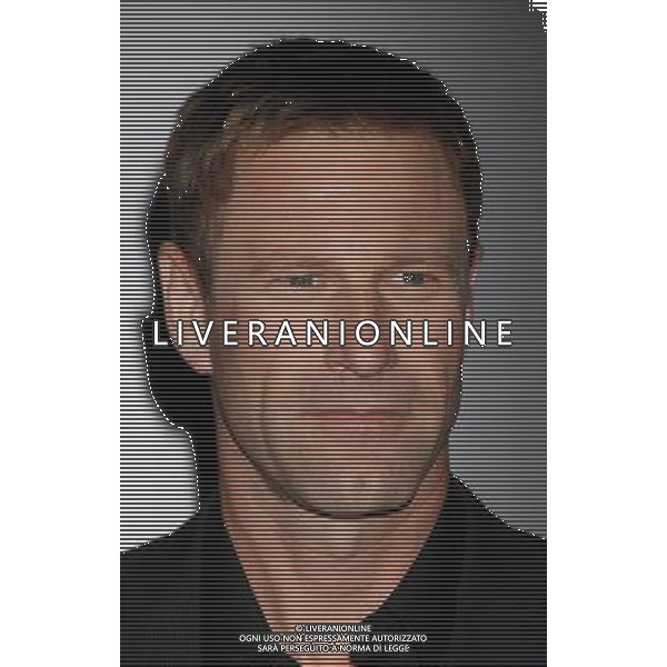 Aaron Eckhart Photo by Janet Gough \'Battle: Los Angeles\' Los Angeles Premiere at the Regency Village Theatre March 8, 2011 - Westwood, California /AG ALDO LIVERANI SAS - ITALY ONLY -