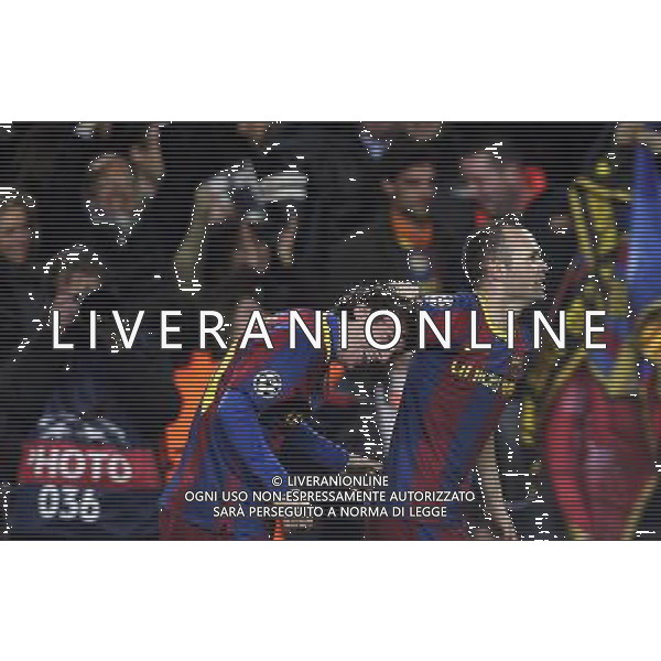 Barcelona\'s players Andres Iniesta (right) congratulates Lionel Messi (centre) for his first goal against Arsenal during the UEFA Champions League second round of 16 match between Barcelona FC and Arsenal in the Nou Camp Stadium, Barcelona, Spain, 8 March 2011. AG. ALDO LIVERANI SAS ITALY ONLY *** Local Caption *** .