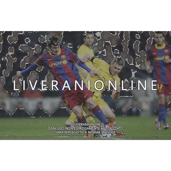Barcelona\'s Lionel Messi (left) and Arsenal\'s Jack Wilshere fight for the ball during the UEFA Champions League second round of 16 match between Barcelona FC and Arsenal in the Nou Camp Stadium, Barcelona, Spain, 8 March 2011. Barcelona won 3-1. AG. ALDO LIVERANI SAS ITALY ONLY *** Local Caption *** .