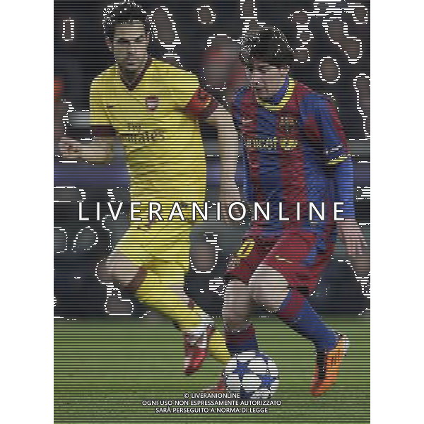 Barcelona\'s Lionel Messi (right) leads the ball next to Arsenal\'s Cesc Fabregas during the UEFA Champions League second round of 16 match between Barcelona FC and Arsenal in the Nou Camp Stadium, Barcelona, Spain, 8 March 2011. Barcelona won 3-1. AG. ALDO LIVERANI SAS ITALY ONLY *** Local Caption *** .