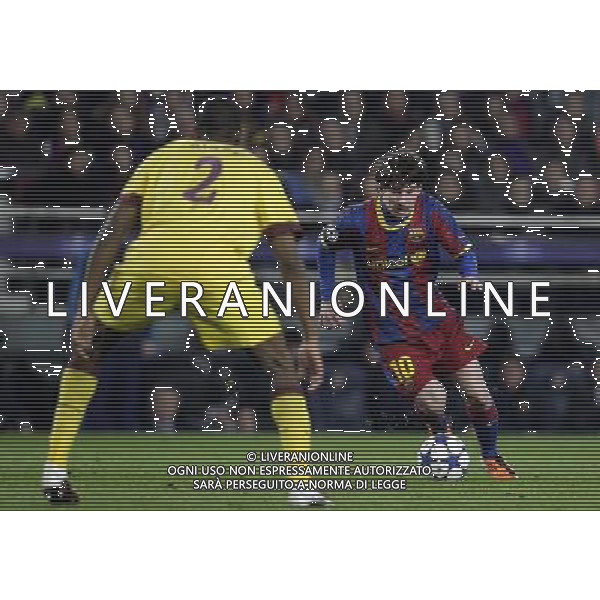 Barcelona\'s Lionel Messi faces Arsenal\'s Abou Diaby during the UEFA Champions League second round of 16 match between Barcelona FC and Arsenal in the Nou Camp Stadium, Barcelona, Spain, 8 March 2011. Barcelona won 3-1. AG. ALDO LIVERANI SAS ITALY ONLY *** Local Caption *** .