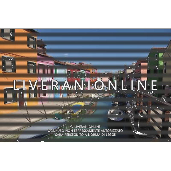 (110309) -- VENICE, March 9, 2011 () -- Photo taken on March 8, 2011 shows the brightly-painted houses at Burano, an outlying island northeast of Venice, Italy. Villagers of the island have a long tradition to paint their houses colorfully, which today have become the main feature of the island. (/Wang Qingqin) (wjd) Vista della citta\' AG. ALDO LIVERANI SAS ITALY ONLY *** Local Caption *** .