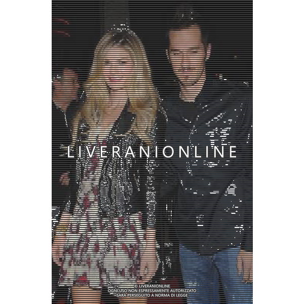 Marisa Miller and husband Griffin Guess Photo by Gilbert Flores \'The Lincoln Lawyer\' Los Angeles Screening at the ArcLight Cinemas March 10, 2011 - Hollywood, California AG. ALDO LIVERANI SAS ITALY ONLY *** Local Caption *** .