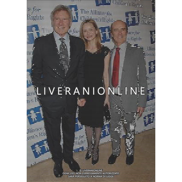 Harrison Ford, wife Calista Flockhart and Skip Brittenham Photo by Janet Gough 18th Annual Alliance For Children\'s Rights Gala at the Beverly Hilton Hotel March 10, 2011 - Beverly Hills, California AG.ALDO LIVERANI SAS ITALY ONLY