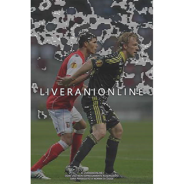 20110310: BRAGA, PORTUGAL - SC Braga vs Liverpool FC: Europa League 2010/2011, round of 8, 1st leg. In picture: Kaka and Dirk Kuyt. PHOTO: Pedro Benavente/CITYFILES LIGA EUROPY UEFA SEZON 2010/2011 PILKA NOZNA BRAGA - LIVERPOOL FOT. CITYFILES/NEWSPIX.PL PORTUGAL,BRAZIL,SPAIN,GERMANY,FRANCE,UK OUT !!! --- Newspix.pl EUROIPA LEAGUE BRAGA-LIVERPOOL ©AG ALDO LIVERNAI SAS - ITALY ONLY - *** Local Caption *** .