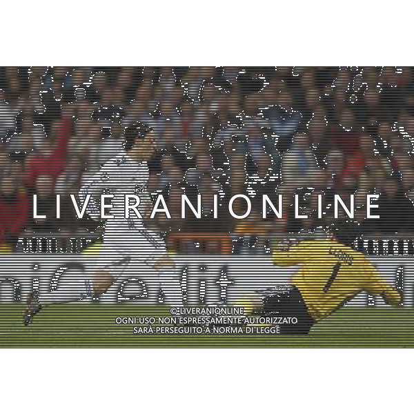 Real Madrid\'s Mesut Ozil and Olimpique Lyon\'s Hugo Lloris during Champions League match in Madrid on March 16th 2011. Photo: Cid-Fuentes / Cebolla / ALFAQUI AG ALDO LIVERANI ONLY ITALY