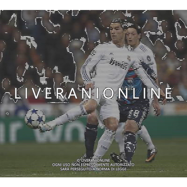 Real Madrid\'s Cristiano Ronaldo and Olimpique Lyon\'s during Champions League match in Madrid on March 16th 2011. AG ALDO LIVERANI S A S ONLY ITALY