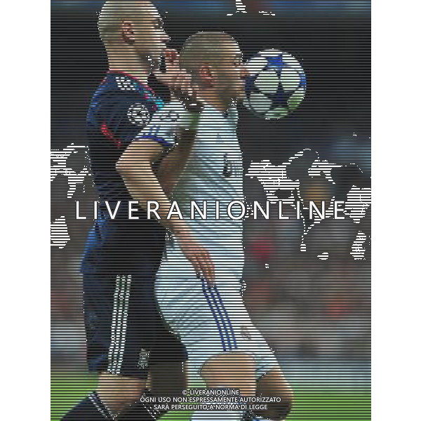 (110317) -- MADRID, March 17, 2011 () -- Karim Benzema (R) of Real Madrid competes during the match against Olympique Lyon at the 2010/11 UEFA Champions League at Santiago Bernabeu Stadium in Madrid on March 16, 2011. Madrid defeated Lyon by 3-0. On aggregate 4-1, Real Madrid completed the lineup for quarter finals. (/Chen Haitong) (lm) AG ALDO LIVERANI S A S ONLY ITALY
