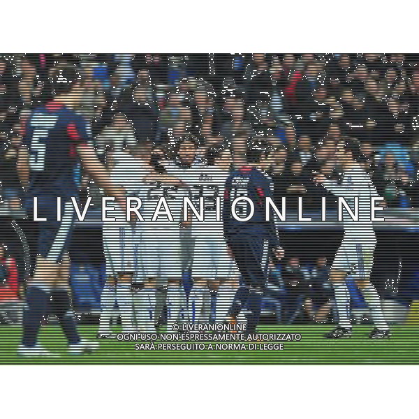 (110317) -- MADRID, March 17, 2011 () -- Players (in white) of Real Madrid celebrate for a goal during the match against Olympique Lyon at the 2010/11 UEFA Champions League at Santiago Bernabeu Stadium in Madrid on March 16, 2011. Madrid defeated Lyon by 3-0. On aggregate 4-1, Real Madrid completed the lineup for quarter finals. (/Chen Haitong) (lm) AG ALDO LIVERANI S A S ONLY ITALY