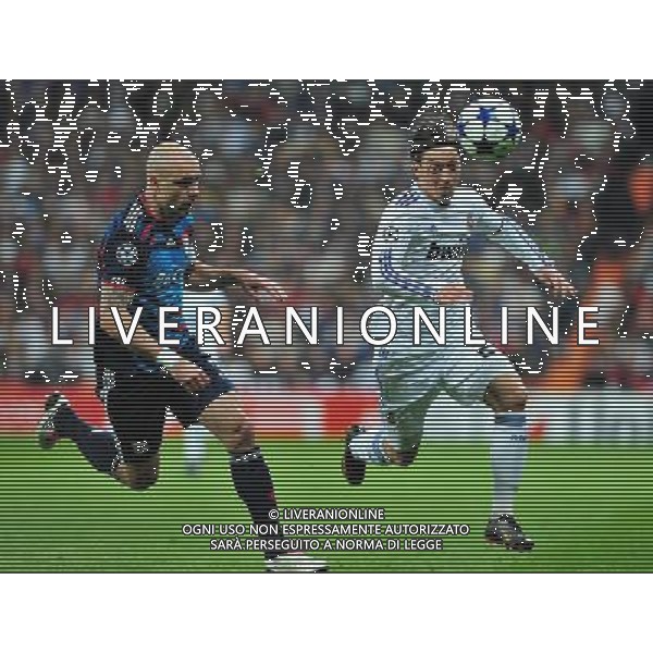 (110317) -- MADRID, March 17, 2011 () -- Mesut Ozil (R) of Real Madrid competes during the match against Olympique Lyon at the 2010/11 UEFA Champions League at Santiago Bernabeu Stadium in Madrid on March 16, 2011. Madrid defeated Lyon by 3-0. On aggregate 4-1, Real Madrid completed the lineup for quarter finals. (/Chen Haitong) (lm) AG ALDO LIVERANI S A S ONLY ITALY