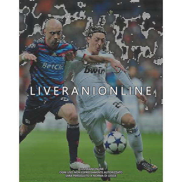 (110317) -- MADRID, March 17, 2011 () -- Mesut Ozil (R) of Real Madrid competes during the match against Olympique Lyon at the 2010/11 UEFA Champions League at Santiago Bernabeu Stadium in Madrid on March 16, 2011. Madrid defeated Lyon by 3-0. On aggregate 4-1, Real Madrid completed the lineup for quarter finals. (/Chen Haitong) (lm) AG ALDO LIVERANI S A S ONLY ITALY