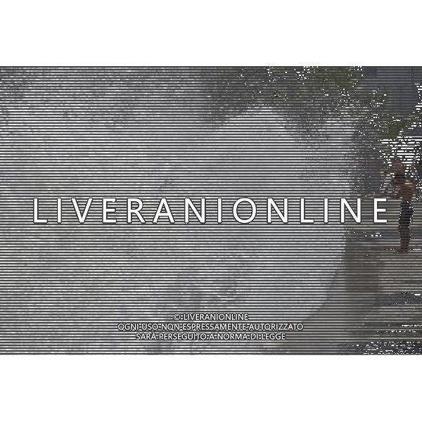 (110317) -- RIO DE JANEIRO, March 17, 2011 () -- A man checks his surfing board near waves at Arpoador Beach, in Rio de Janeiro, Brazil, on March 16, 2011. Strong winds and an extratropical cyclone created rough seas off the southeast coast of Brazil. (/Agencia Estado)(BRAZIL OUT) (ce) AG. ALDO LIVERANI SAS ITALY ONLY *** Local Caption *** .