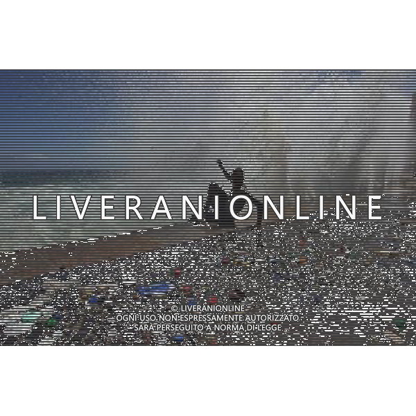 (110317) -- RIO DE JANEIRO, March 17, 2011 () -- A wave hits a young man at Arpoador Beach, in Rio de Janeiro, Brazil, on March 16, 2011. Strong winds and an extratropical cyclone created rough seas off the southeast coast of Brazil. (/Agencia Estado)(BRAZIL OUT) (ce) AG. ALDO LIVERANI SAS ITALY ONLY *** Local Caption *** .