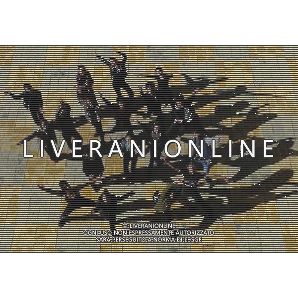 (110403) -- LHASA, April 3, 2011 () -- Students of the Tibetan Opera major pose for photo in Tibet University in Lhasa, capital of southwest China\'s Tibet Autonomous Region, April 2, 2011. At the School of Arts of Tibet University, there are eighteen Tibetan youth, who are among the first class of undergraduates majoring in Tibetan Opera in China. They are now making unremitting efforts in learning the opera, the time-honored folk art held as \'live fossil of Tibetan culture\'. In 2008, a total of eighteen students from Lhasa, Shigatse, Chamdo and other parts of Tibet Autonomous Region were selected into the undergraduate class of Tibetan Opera Major of Tibet University, the first of its type in China. Today, aged between 17 to 23, these girls and boys are at their third year of college. With three years\' hard training and strict instructions from Tibetan Opera artists, they have made great progresses in all facets from opera singing, dancing to repertoire performances. Wearing the traditional costumes and masks, they dance and sing at the beat of drum and cymbal, with an air of mystery and religious majesty. However, not all of them knew well about Tibetan Opera before entering college. Gongsang Yangzong, 17 years old, was once a hip-hop fan who was just fond of pop culture. She took the major in Tibetan Opera by mere chance. But with the study going further, she has been thoroughly enchanted by this ancient art. \'The Tibetan Opera sets a demanding standard for performers. One must be excellent in both dancing and singing, and also be conversant with Tibetan Culture, religion and history. I am proud of being a Tibetan to inherit the treasure of our people and present it to the world. \' Now, besides the cultural courses, Gongsang Yangzong and other 17 classmates are having six singing classes, ten dancing skill classes and 12 opera or dance repertoire classes every week. Before the birth of the undergraduate class, the School of Arts of Tibetan U AG. ALDO LIVERANI SAS ITALY ONLY *** Local Caption *** .