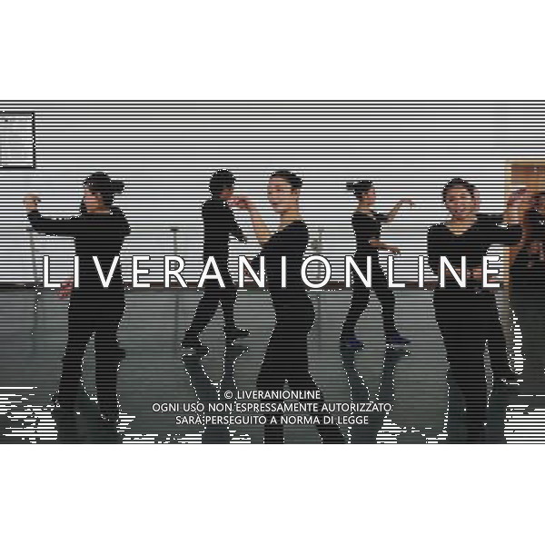 (110403) -- LHASA, April 3, 2011 () -- Students of the Tibetan Opera major have a class in Tibet University in Lhasa, capital of southwest China\'s Tibet Autonomous Region, March 30, 2011. At the School of Arts of Tibet University, there are eighteen Tibetan youth, who are among the first class of undergraduates majoring in Tibetan Opera in China. They are now making unremitting efforts in learning the opera, the time-honored folk art held as \'live fossil of Tibetan culture\'. In 2008, a total of eighteen students from Lhasa, Shigatse, Chamdo and other parts of Tibet Autonomous Region were selected into the undergraduate class of Tibetan Opera Major of Tibet University, the first of its type in China. Today, aged between 17 to 23, these girls and boys are at their third year of college. With three years\' hard training and strict instructions from Tibetan Opera artists, they have made great progresses in all facets from opera singing, dancing to repertoire performances. Wearing the traditional costumes and masks, they dance and sing at the beat of drum and cymbal, with an air of mystery and religious majesty. However, not all of them knew well about Tibetan Opera before entering college. Gongsang Yangzong, 17 years old, was once a hip-hop fan who was just fond of pop culture. She took the major in Tibetan Opera by mere chance. But with the study going further, she has been thoroughly enchanted by this ancient art. \'The Tibetan Opera sets a demanding standard for performers. One must be excellent in both dancing and singing, and also be conversant with Tibetan Culture, religion and history. I am proud of being a Tibetan to inherit the treasure of our people and present it to the world. \' Now, besides the cultural courses, Gongsang Yangzong and other 17 classmates are having six singing classes, ten dancing skill classes and 12 opera or dance repertoire classes every week. Before the birth of the undergraduate class, the School of Arts of Tibetan Un AG. ALDO LIVERANI SAS ITALY ONLY *** Local Caption *** .