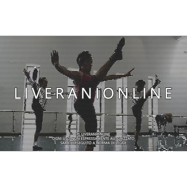 (110403) -- LHASA, April 3, 2011 () -- Students of the Tibetan Opera major have a class in Tibet University in Lhasa, capital of southwest China\'s Tibet Autonomous Region, March 30, 2011. At the School of Arts of Tibet University, there are eighteen Tibetan youth, who are among the first class of undergraduates majoring in Tibetan Opera in China. They are now making unremitting efforts in learning the opera, the time-honored folk art held as \'live fossil of Tibetan culture\'. In 2008, a total of eighteen students from Lhasa, Shigatse, Chamdo and other parts of Tibet Autonomous Region were selected into the undergraduate class of Tibetan Opera Major of Tibet University, the first of its type in China. Today, aged between 17 to 23, these girls and boys are at their third year of college. With three years\' hard training and strict instructions from Tibetan Opera artists, they have made great progresses in all facets from opera singing, dancing to repertoire performances. Wearing the traditional costumes and masks, they dance and sing at the beat of drum and cymbal, with an air of mystery and religious majesty. However, not all of them knew well about Tibetan Opera before entering college. Gongsang Yangzong, 17 years old, was once a hip-hop fan who was just fond of pop culture. She took the major in Tibetan Opera by mere chance. But with the study going further, she has been thoroughly enchanted by this ancient art. \'The Tibetan Opera sets a demanding standard for performers. One must be excellent in both dancing and singing, and also be conversant with Tibetan Culture, religion and history. I am proud of being a Tibetan to inherit the treasure of our people and present it to the world. \' Now, besides the cultural courses, Gongsang Yangzong and other 17 classmates are having six singing classes, ten dancing skill classes and 12 opera or dance repertoire classes every week. Before the birth of the undergraduate class, the School of Arts of Tibetan Un AG. ALDO LIVERANI SAS ITALY ONLY *** Local Caption *** .