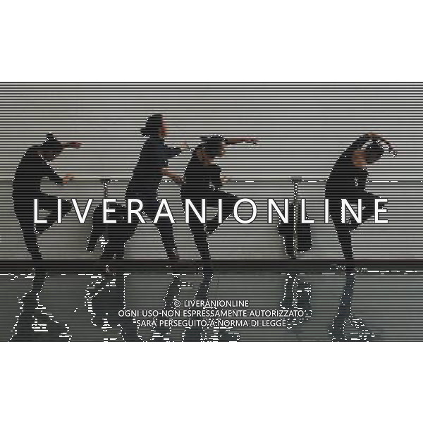 (110403) -- LHASA, April 3, 2011 () -- Students of the Tibetan Opera major have a class in Tibet University in Lhasa, capital of southwest China\'s Tibet Autonomous Region, March 30, 2011. At the School of Arts of Tibet University, there are eighteen Tibetan youth, who are among the first class of undergraduates majoring in Tibetan Opera in China. They are now making unremitting efforts in learning the opera, the time-honored folk art held as \'live fossil of Tibetan culture\'. In 2008, a total of eighteen students from Lhasa, Shigatse, Chamdo and other parts of Tibet Autonomous Region were selected into the undergraduate class of Tibetan Opera Major of Tibet University, the first of its type in China. Today, aged between 17 to 23, these girls and boys are at their third year of college. With three years\' hard training and strict instructions from Tibetan Opera artists, they have made great progresses in all facets from opera singing, dancing to repertoire performances. Wearing the traditional costumes and masks, they dance and sing at the beat of drum and cymbal, with an air of mystery and religious majesty. However, not all of them knew well about Tibetan Opera before entering college. Gongsang Yangzong, 17 years old, was once a hip-hop fan who was just fond of pop culture. She took the major in Tibetan Opera by mere chance. But with the study going further, she has been thoroughly enchanted by this ancient art. \'The Tibetan Opera sets a demanding standard for performers. One must be excellent in both dancing and singing, and also be conversant with Tibetan Culture, religion and history. I am proud of being a Tibetan to inherit the treasure of our people and present it to the world. \' Now, besides the cultural courses, Gongsang Yangzong and other 17 classmates are having six singing classes, ten dancing skill classes and 12 opera or dance repertoire classes every week. Before the birth of the undergraduate class, the School of Arts of Tibetan Un AG. ALDO LIVERANI SAS ITALY ONLY *** Local Caption *** .