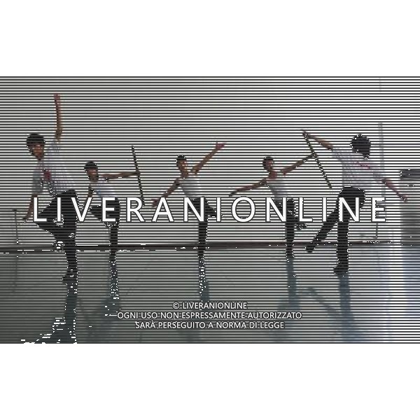 (110403) -- LHASA, April 3, 2011 () -- Students of the Tibetan Opera major have a class in Tibet University in Lhasa, capital of southwest China\'s Tibet Autonomous Region, March 30, 2011. At the School of Arts of Tibet University, there are eighteen Tibetan youth, who are among the first class of undergraduates majoring in Tibetan Opera in China. They are now making unremitting efforts in learning the opera, the time-honored folk art held as \'live fossil of Tibetan culture\'. In 2008, a total of eighteen students from Lhasa, Shigatse, Chamdo and other parts of Tibet Autonomous Region were selected into the undergraduate class of Tibetan Opera Major of Tibet University, the first of its type in China. Today, aged between 17 to 23, these girls and boys are at their third year of college. With three years\' hard training and strict instructions from Tibetan Opera artists, they have made great progresses in all facets from opera singing, dancing to repertoire performances. Wearing the traditional costumes and masks, they dance and sing at the beat of drum and cymbal, with an air of mystery and religious majesty. However, not all of them knew well about Tibetan Opera before entering college. Gongsang Yangzong, 17 years old, was once a hip-hop fan who was just fond of pop culture. She took the major in Tibetan Opera by mere chance. But with the study going further, she has been thoroughly enchanted by this ancient art. \'The Tibetan Opera sets a demanding standard for performers. One must be excellent in both dancing and singing, and also be conversant with Tibetan Culture, religion and history. I am proud of being a Tibetan to inherit the treasure of our people and present it to the world. \' Now, besides the cultural courses, Gongsang Yangzong and other 17 classmates are having six singing classes, ten dancing skill classes and 12 opera or dance repertoire classes every week. Before the birth of the undergraduate class, the School of Arts of Tibetan Un AG. ALDO LIVERANI SAS ITALY ONLY *** Local Caption *** .