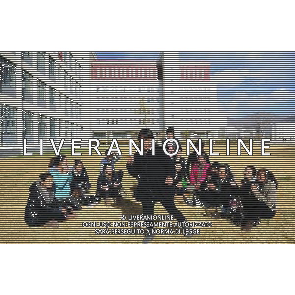 (110403) -- LHASA, April 3, 2011 () -- Students of the Tibetan Opera major watch their classmate Gongsang Yangzong(C) performing hip-pop in Tibet University in Lhasa, capital of southwest China\'s Tibet Autonomous Region, April 3, 2011. At the School of Arts of Tibet University, there are eighteen Tibetan youth, who are among the first class of undergraduates majoring in Tibetan Opera in China. They are now making unremitting efforts in learning the opera, the time-honored folk art held as \'live fossil of Tibetan culture\'. In 2008, a total of eighteen students from Lhasa, Shigatse, Chamdo and other parts of Tibet Autonomous Region were selected into the undergraduate class of Tibetan Opera Major of Tibet University, the first of its type in China. Today, aged between 17 to 23, these girls and boys are at their third year of college. With three years\' hard training and strict instructions from Tibetan Opera artists, they have made great progresses in all facets from opera singing, dancing to repertoire performances. Wearing the traditional costumes and masks, they dance and sing at the beat of drum and cymbal, with an air of mystery and religious majesty. However, not all of them knew well about Tibetan Opera before entering college. Gongsang Yangzong, 17 years old, was once a hip-hop fan who was just fond of pop culture. She took the major in Tibetan Opera by mere chance. But with the study going further, she has been thoroughly enchanted by this ancient art. \'The Tibetan Opera sets a demanding standard for performers. One must be excellent in both dancing and singing, and also be conversant with Tibetan Culture, religion and history. I am proud of being a Tibetan to inherit the treasure of our people and present it to the world. \' Now, besides the cultural courses, Gongsang Yangzong and other 17 classmates are having six singing classes, ten dancing skill classes and 12 opera or dance repertoire classes every week. Before the birth of the under AG. ALDO LIVERANI SAS ITALY ONLY *** Local Caption *** .