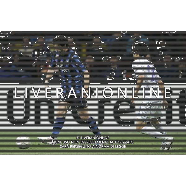 Milano 05-04-2011 Champions League 2010/11 inter-schalke 5:2 nella foto diego alberto milito e atsuto uchida ph marco luzzani/ag aldo liverani s.a.s.