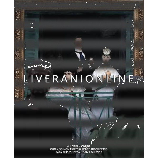 (110404) -- PARIS, April 4, 2011 () -- A woman looks at the painting \'The Balcony, 1868-1869\' by French painter Edouard Manet (1832-1883) during the media day at the exhibition \'Manet, the Man who invented Modernity\' at the Orsay Musuem in Paris, France, April 4, 2011. The exhibition will be held from April 5 to July 3, 2011. (/Gao Jing) (zw) Moatra d\'arte di Manet AG. ALDO LIVERANI SAS ITALY ONLY *** Local Caption *** .