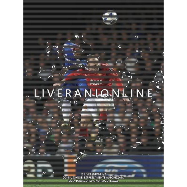(110407) -- LONDON, April 7, 2011 () -- Wayne Rooney (R) of Manchester United and Michael Essien of Chelsea vie for a header during the first leg match of the 2010/11 UEFA Champions League quarter-finals at Stamford Bridge in London, Britain, April 6, 2011. Manchester United won by 1-0. (/Zeng Yi) ©PHOTOSHOT/AGENZIA ALDO LIVERANI SAS - ITALY ONLY - EDITORIAL USE ONLY - CHELSEA - MANCHESTER UNITED ANDATA QUARTI DI FINALE DI CHAMPIONS LEAGUE 06/04/2011