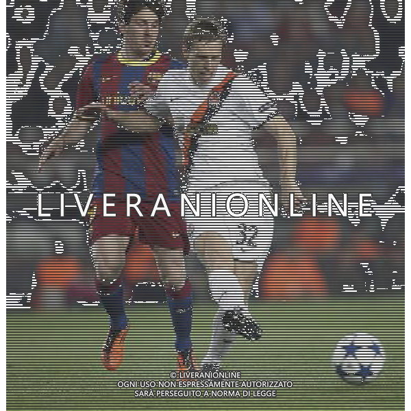 Barcelona\'s Lionel Messi and Shaktar Donetsk\'s Mykola Ishchenko during Champions League match on April, 6th 2011. Photo: Cesar Cebolla / ALFAQUI /ALDO LIVERANI CHAMPIONS LEAGUE BARCELLONA - FC Shakhtar Donetsk ANDATA DEI QUARTI DI FINALE - ITALY ONLY - *** Local Caption *** .