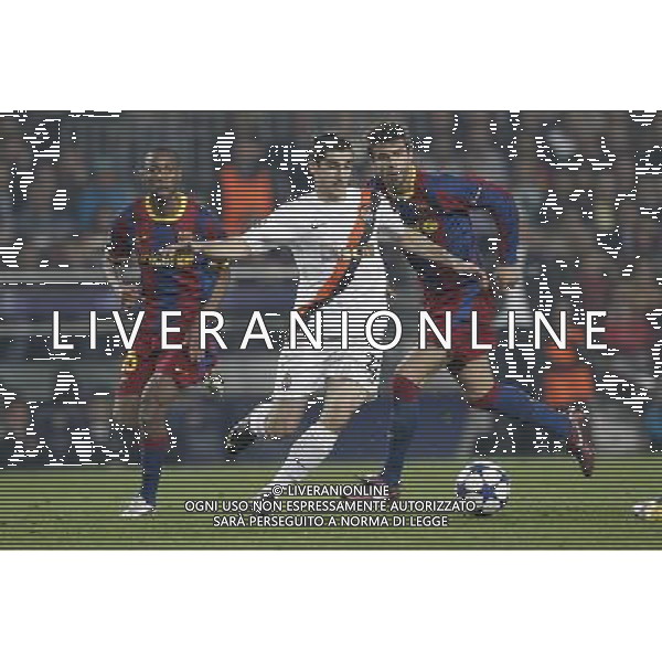 Barcelona\'s Gerard Pique and Shaktar Donetsk\'s Henryk Mkhitaryan during Champions League match on April, 6th 2011. Photo: Cesar Cebolla / ALFAQUI /ALDO LIVERANI CHAMPIONS LEAGUE BARCELLONA - FC Shakhtar Donetsk ANDATA DEI QUARTI DI FINALE - ITALY ONLY - *** Local Caption *** .