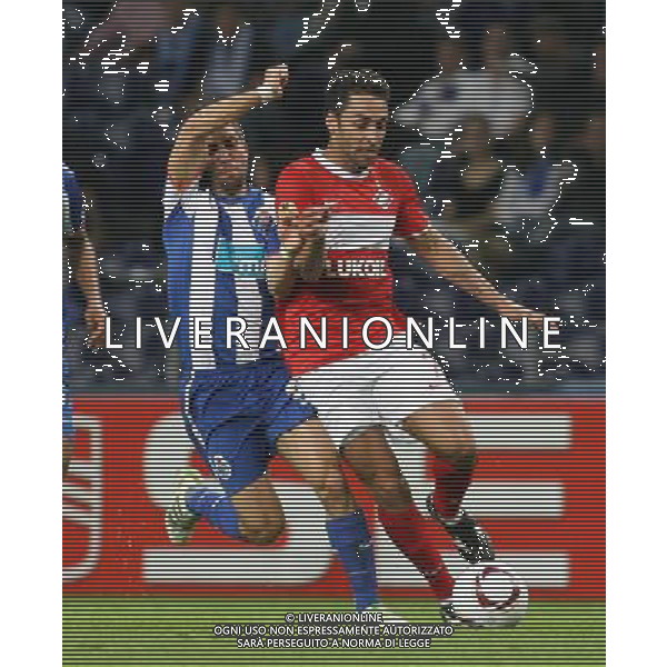 20110407: PORTO, PORTUGAL - FC Porto vs Spartak Moscow: UEFA Europa League 2010/2011 - Quarter-Finals, First Leg. In picture: Joao Moutinho (Porto) and Ibson (Spartak). PHOTO: Manuel Azevedo/CITYFILES AG ALDO LIVERANI ONLY ITALY