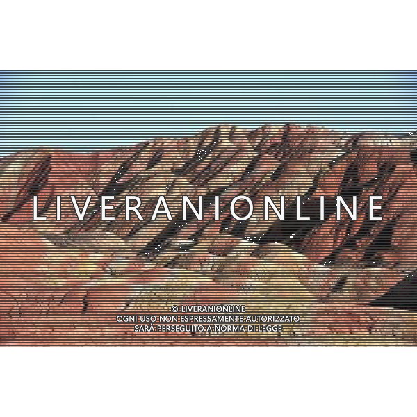 (110412) ZHANGYE, April 12, 2011 () Danxia landform is seen at a geopark near Zhangye, northwest China\'s Gansu Province, April 11, 2011. Danxia, which means \'rosy cloud,\' is a special landform formed from reddish sandstone that has been eroded over time into a series of mountains surrounded by curvaceous cliffs and many unusual rock formations. (/Gao Jianjun) (lfj) Geoparco a Zhangye , morfologia Danxia che significa \'nuvola rosa\',  una morfologia speciale formata da arenaria rossastra che  stata erosa nel tempo in una serie di montagne circondate da pareti curve formazioni rocciose insolite AG. ALDO LIVERANI SAS ITALY ONLY *** Local Caption *** .