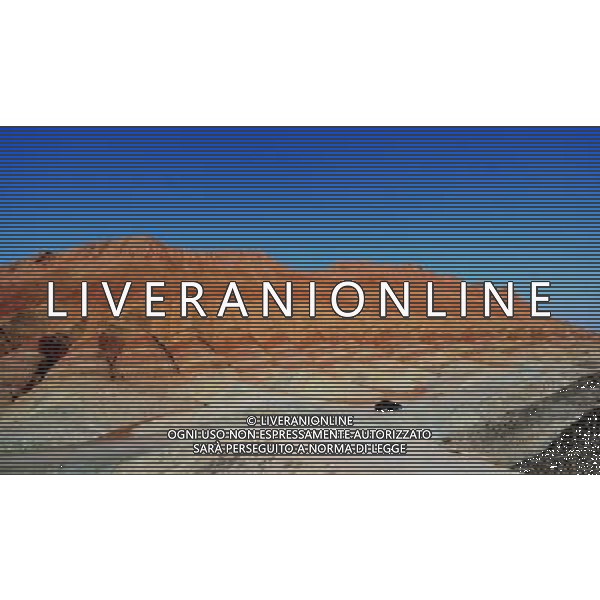 (110412) ZHANGYE, April 12, 2011 () Danxia landform is seen at a geopark near Zhangye, northwest China\'s Gansu Province, April 11, 2011. Danxia, which means \'rosy cloud,\' is a special landform formed from reddish sandstone that has been eroded over time into a series of mountains surrounded by curvaceous cliffs and many unusual rock formations. (/Gao Jianjun) (lfj) Geoparco a Zhangye , morfologia Danxia che significa \'nuvola rosa\',  una morfologia speciale formata da arenaria rossastra che  stata erosa nel tempo in una serie di montagne circondate da pareti curve formazioni rocciose insolite AG. ALDO LIVERANI SAS ITALY ONLY *** Local Caption *** .