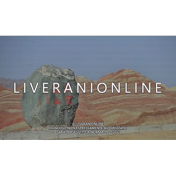 (110412) ZHANGYE, April 12, 2011 () Danxia landform is seen at a geopark near Zhangye, northwest China\'s Gansu Province, April 11, 2011. Danxia, which means \'rosy cloud,\' is a special landform formed from reddish sandstone that has been eroded over time into a series of mountains surrounded by curvaceous cliffs and many unusual rock formations. (/Gao Jianjun) (lfj) Geoparco a Zhangye , morfologia Danxia che significa \'nuvola rosa\',  una morfologia speciale formata da arenaria rossastra che  stata erosa nel tempo in una serie di montagne circondate da pareti curve formazioni rocciose insolite AG. ALDO LIVERANI SAS ITALY ONLY *** Local Caption *** .