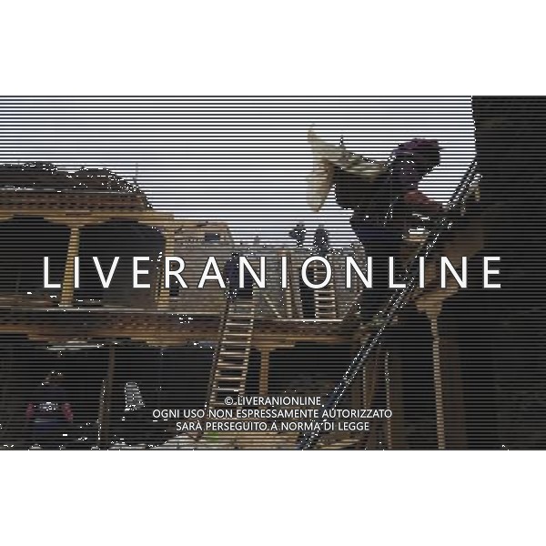 (110414) LHASA, April 14, 2011 () Photo taken on April 7, 2011 shows a historical compound under renovation, at Parkhor Street, in Lhasa, capital of southwest China\'s Tibet Autonomous Region. As one of the most distinct and attractive old blocks in the world, Parkhor Street is unique with contrastive features and stunning diversity. It is a place where Tibetan tradition meets modern fashion, religious sanctity mixes with commercial prosperity. Located in the center of Lhasa, surrounding the Jokhang Temple, it covers an area of 133.82 hectares and has 35 small streets and alleys extending in all directions. The Tibetan word Parkhor literally means \'an annular worshipping road\', which refers to the main street of the block. The main street, about two kilometers long, functions as the most important road for pilgrimage, local business, and tourism. In its 1400 years\' long history, Parkhor Street has witnessed the eclipse and prosperity of Buddhism, the exchange and fusion of the diverse cultures, the flourishing of ancient trade, the continuous changes of the regimes, and the ups and downs of Lhasa. Because of its unmatched location and cultural signification, Parkhor Street has long been considered as the epitome of Lhasa\'s historical development. It is the earliest and most prosperous business street in the city, crowded with merchants from all over China and even foreign countries such as Nepal and India, selling craftworks and products with rich ethnical features. Since the peaceful liberation of Tibet, the Parkhor Street has undergone fundamental changes. Common people moved into the former residence of noble families, handcraft workshops and stores appeared one after another, and shabby street infrastructure were thoroughly renovated. Along with China\'s Reform and Opening Up, the Parkhor Street in 1980\'s and 1990\'s saw a rise of commerce with increasing shops and abundant commodities. Tibetan artworks and craftworks gradually went popular in AG ALDO LIVERANI ONLY ITALY