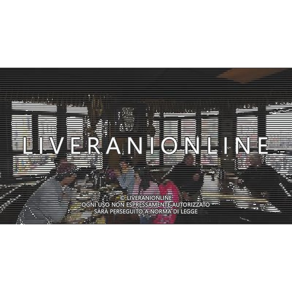 (110414) LHASA, April 14, 2011 () Tourists have meal at Makye Ame Restaurant at a corner of the Parkhor Street, in Lhasa, capital of southwest China\'s Tibet Autonomous Region, April 7, 2011. As one of the most distinct and attractive old blocks in the world, Parkhor Street is unique with contrastive features and stunning diversity. It is a place where Tibetan tradition meets modern fashion, religious sanctity mixes with commercial prosperity. Located in the center of Lhasa, surrounding the Jokhang Temple, it covers an area of 133.82 hectares and has 35 small streets and alleys extending in all directions. The Tibetan word Parkhor literally means \'an annular worshipping road\', which refers to the main street of the block. The main street, about two kilometers long, functions as the most important road for pilgrimage, local business, and tourism. In its 1400 years\' long history, Parkhor Street has witnessed the eclipse and prosperity of Buddhism, the exchange and fusion of the diverse cultures, the flourishing of ancient trade, the continuous changes of the regimes, and the ups and downs of Lhasa. Because of its unmatched location and cultural signification, Parkhor Street has long been considered as the epitome of Lhasa\'s historical development. It is the earliest and most prosperous business street in the city, crowded with merchants from all over China and even foreign countries such as Nepal and India, selling craftworks and products with rich ethnical features. Since the peaceful liberation of Tibet, the Parkhor Street has undergone fundamental changes. Common people moved into the former residence of noble families, handcraft workshops and stores appeared one after another, and shabby street infrastructure were thoroughly renovated. Along with China\'s Reform and Opening Up, the Parkhor Street in 1980\'s and 1990\'s saw a rise of commerce with increasing shops and abundant commodities. Tibetan artworks and craftworks gradually went popular in t AG ALDO LIVERANI ONLY ITALY