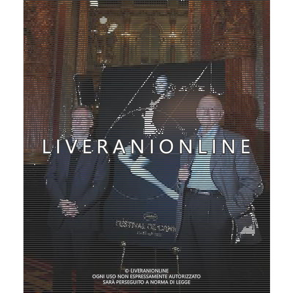 (110414) -- PARIS, April 14, 2011 () -- Gilles Jacob (R), president of the Cannes Film Festival, and Thierry Fremaux, general delegate of the Cannes Festival, pose with the festival official poster during a press conference to announce the selection of competing films, in Paris, France, April 14, 2011. The 64th Cannes Film Festival will open on May 11 with U.S. actor and director Robert De Niro presiding over the jury and 19 films competing for the Palme d\'Or award. (/Gao Jing) (zw) PARIGI, 14 aprile 2011 () - Gilles Jacob (R), presidente del Festival di Cannes, e di Thierry Fremaux, delegato generale del Festival di Cannes, in posa con il manifesto ufficiale del festival nel corso di una conferenza stampa per annunciare la selezione dei concorrenti film, a Parigi, Francia, 14 aprile 2011 AG. ALDO LIVERANI SAS ITALY ONLY *** Local Caption *** .