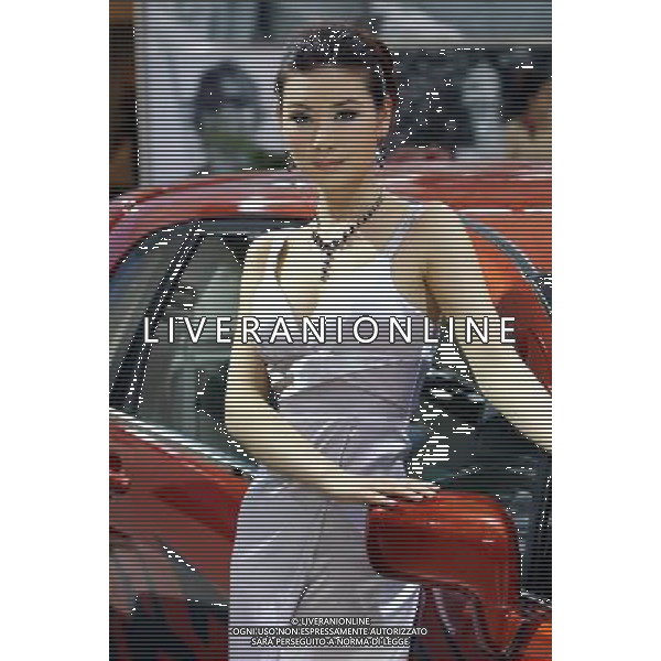 (110419) SHANGHAI, April 19, 2011 A showgirl poses during the press preview of the 14th Shanghai International Automobile Industry Exhibition in east China\'s Shanghai, April 19, 2011. The Exhibition, which kicked off here Tuesday, will be open to the public from April 21 to 28. About 2,000 carmakers and parts providers from 20 countries are due to showcase 1,100 car models, 75 of which makes their world premieres in the auto show. (ljh) Anteprima per la stampa del 14mo Shanghai International Automobile Industry Exhibition AG. ALDO LIVERANI SAS ITALY ONLY *** Local Caption *** .