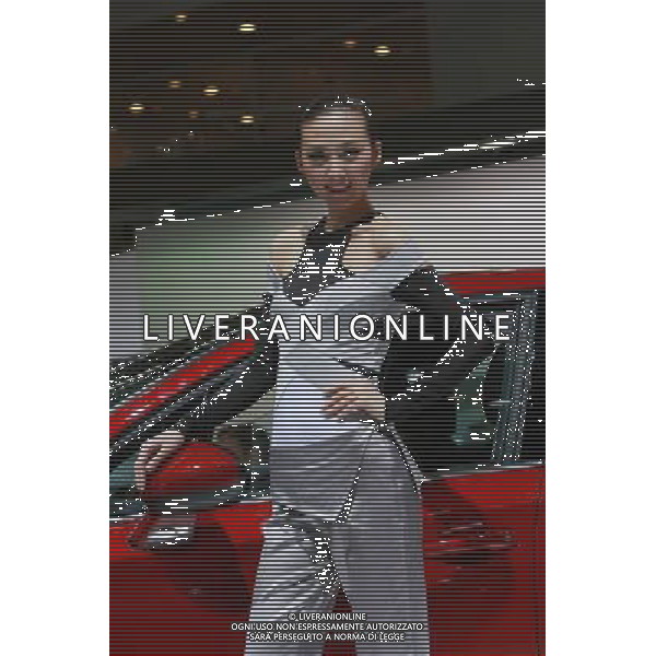 (110419) SHANGHAI, April 19, 2011 A showgirl poses during the press preview of the 14th Shanghai International Automobile Industry Exhibition in east China\'s Shanghai, April 19, 2011. The Exhibition, which kicked off here Tuesday, will be open to the public from April 21 to 28. About 2,000 carmakers and parts providers from 20 countries are due to showcase 1,100 car models, 75 of which makes their world premieres in the auto show. (/Jin Xin) (ljh) Anteprima per la stampa del 14mo Shanghai International Automobile Industry Exhibition AG. ALDO LIVERANI SAS ITALY ONLY *** Local Caption *** .