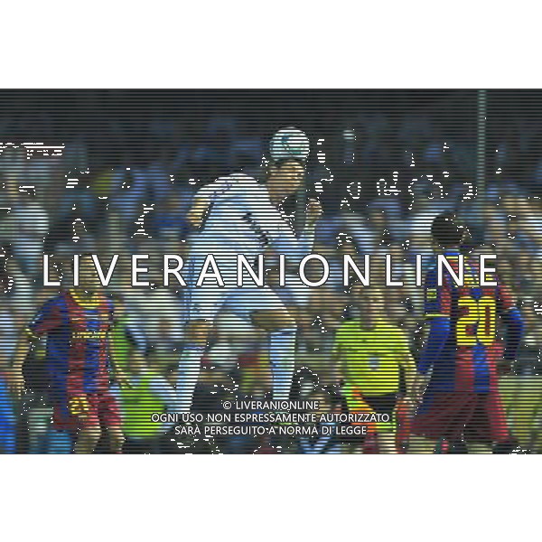 (110421) -- VALENCIA, April 21, 2011 () -- Real Madrid\'s Cristiano Ronaldo(C) heads the ball during the King\'s Cup final soccer match against Barcelona at Mestalla stadium in Valencia, Spain, April 20, 2011. Real Madrid claimed the champion by defeating Barcelona 1-0. (/Chen Haitong) (xm) ©photoshot/Agenzia Aldo Liverani Sas - ITALY ONLY - Real Madrid - Barcellona finale della Coppa del Re allo stadio Mestalla di Valencia, in Spagna, 20 aprile 2011. Real Madrid, ha vinto sconfiggendo Barcellona 1-0.