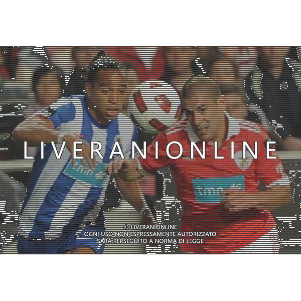 20110420: LISBON, PORTUGAL - SL Benfica vs FC Porto: Portuguese Cup 2010/2011, Semi-Finals, 2nd Leg. In picture: Alvaro Pereira (Porto) and Maxi Pereira (Benfica). PHOTO: Alexandre Pona/CITYFILES PUCHAR PORTUGALII LIGA PORTUGALSKA SEZON 2010/2011 PILKA NOZNA POLFINAL BENFICA LIZBONA vs FC PORTO FOT. CITYFILES/NEWSPIX.PL PORTUGAL,BRAZIL,SPAIN,GERMANY,FRANCE,UK OUT !!! --- Newspix.pl AG ALDO LIVERANI ONLY ITALY *** Local Caption *** www.newspix.pl mail us: info@newspix.pl call us: 0048 022 23 22 222 --- Polish Picture Agency by Ringier Axel Springer Poland