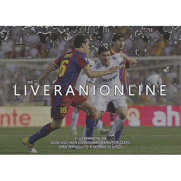 FC Barcelona\'s Leo Messi (b) and Sergio Busquets (l) and Real Madrid\'s Xabi Alonso (f) during King\'s Cup 2001 Final match.April 20,2011. (ALTERPHOTOS/Acero) ALDO LIVERANI S A S ONLY ITALY