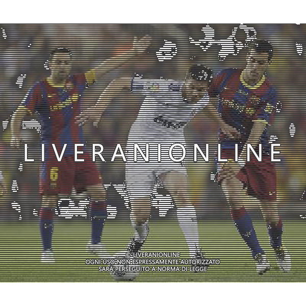 Real Madrid\'s Xabi Alonso vs Barcelona\'s Sergio Busquets and Xavi Hernandez during Spain\'s King\'s Cup Final match in Valencia, Spain on April 20th 2011. Photo: Cesar Cebolla / ALFAQUI ALDO LIVERANI S A S ONLY ITALY