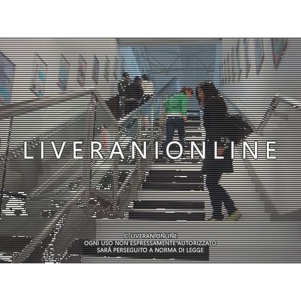 (110421) -- NANJING, April 21, 2011 () -- Pedestrians walk on the piano stairs in Nanjing, capital of east China\'s Jiangsu Province, April 21, 2011. The piano stairs were newly built in metro station of Line 2. When people walk on them, they will send out sweet sound of piano. (/Ji Handong) (zym) Una ragazza cammina sulle scale pianoforte a Nanchino nella stazione della metropolitana della linea 2. Quando la gente cammina sui gradiniquesti manderanno un dolce suono di pianoforte. AG. ALDO LIVERANI SAS ITALY ONLY *** Local Caption *** .