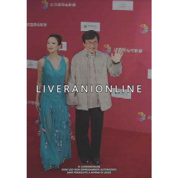 (110423) -- BEIJING, April 23, 2011 -- Movie stars Jackie Chan and Zhang Ziyi (L) pose on the red carpet during the opening ceremony of the first Beijing International Film Festival at the National Center for the Performing Arts in Beijing, capital of China, April 23, 2011. The six-day event, for which Jackie Chan and Zhang Ziyi were invited as image ambassadors, kicked off here Saturday. Li Fangyu) (ljh) AG ALDO LIVERANI ONLY ITALY