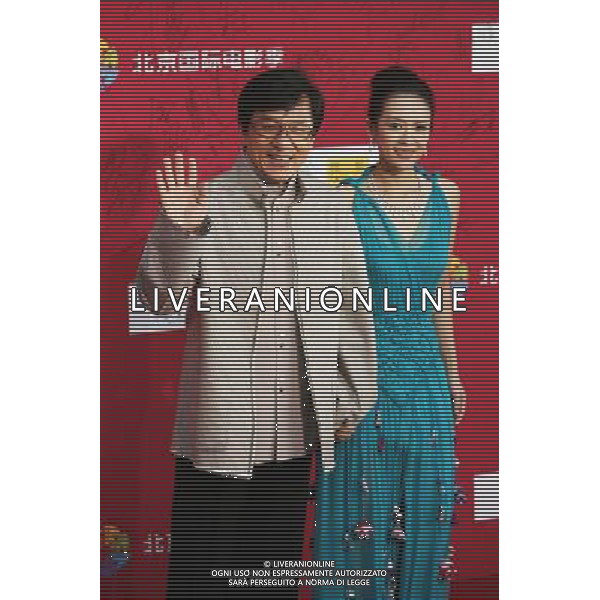 (110423) -- BEIJING, April 23, 2011 -- Movie stars Jackie Chan and Zhang Ziyi (R) pose on the red carpet during the opening ceremony of the first Beijing International Film Festival at the National Center for the Performing Arts in Beijing, capital of China, April 23, 2011. The six-day event, for which Jackie Chan and Zhang Ziyi were invited as image ambassadors, kicked off here Saturday. Li Fangyu) (ljh) AG ALDO LIVERANI ONLY ITALY