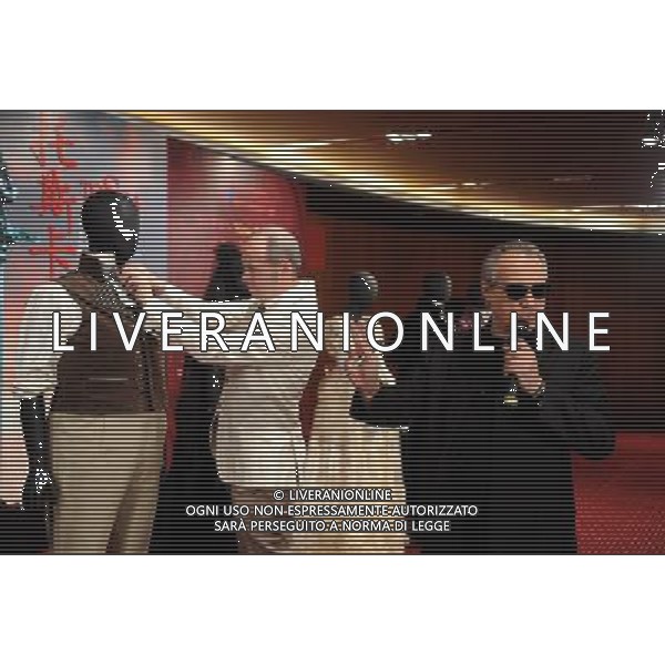 BEIJING, April 26, 2011 Director Giancarlo Del Monaco (R) introduces characters of costumes of the opera \'Tosca\' at the National Center for the Performing Arts in Beijing, capital of China, April 26, 2011. Director Giancarlo Del Monaco, costume designer Jesus Ruiz and five performers of Puccini\'s opera \'Tosca\' participated in the costume show here on Tuesday. The opera will be on shown from May 12 to 15. (/Luo Xiaoguang) (mcg) ©photoshot/Agenzia Aldo Liverani Sas - ITALY ONLY - La costumista Gesu\' Ruiz e cinque esecutori dell\'opera teatrale di Puccini \'Tosca\' durante la mostra dei costumi presso il Centro Nazionale per le Arti dello Spettacolo a Pechino, capitale della Cina, 26 aprile 2011.