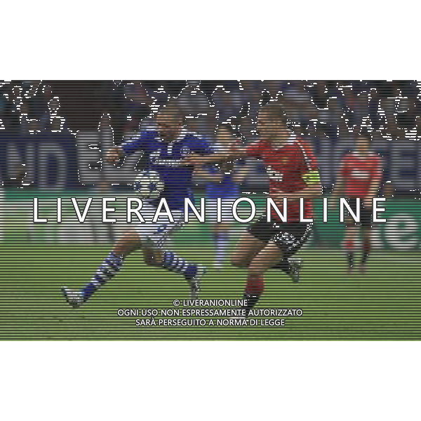 EDU (L) NEMANJA VIDIC (P) SCHALKE 04 GELSENKIRCHEN (NIEBIESKO-BIALE - BLUE-WHITE) - MANCHESTER UNITED (CZERWONO-CZARNE / RED-BLACK) PILKA NOZNA, FOOTBALL, 1/2 FINALU LIGI MISTRZOW, CHAMPIONS LEAGUE SEMI-FINAL 26.04.2011, GELSENKIRCHEN - NIEMCY, GERMANY FOT. DARIUSZ HERMIERSZ / SPORT-FOTO.PL / NEWSPIX.PL --- Newspix.pl ag aldo liverani s a s only italy *** Local Caption *** www.newspix.pl mail us: info@newspix.pl call us: 0048 022 23 22 222 --- Polish Picture Agency by Ringier Axel Springer Poland